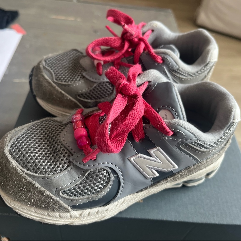 Kids Gray Size 9 New Balance 2002R with custom pink laces and beads